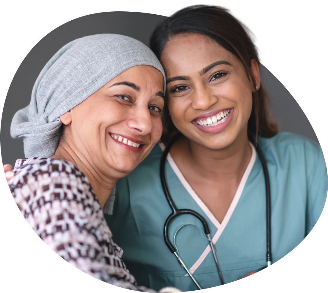 Two Indian ladies one a nurse, the other a patient