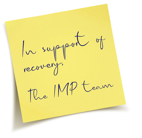 Sticky note with the words "In support of recovery, the IMP team"